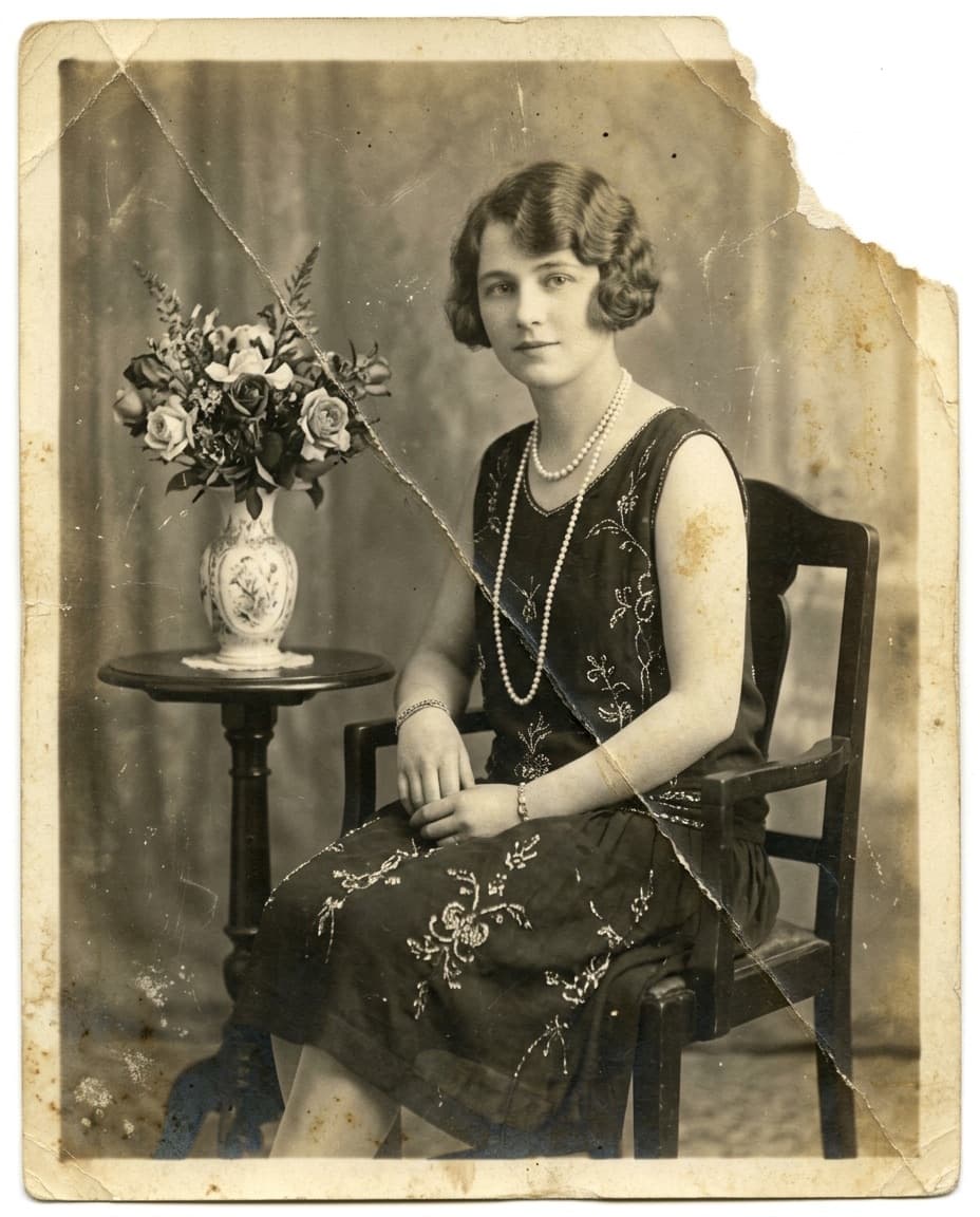 Original: A 1920s studio portrait, cracked across the middle and yellowed